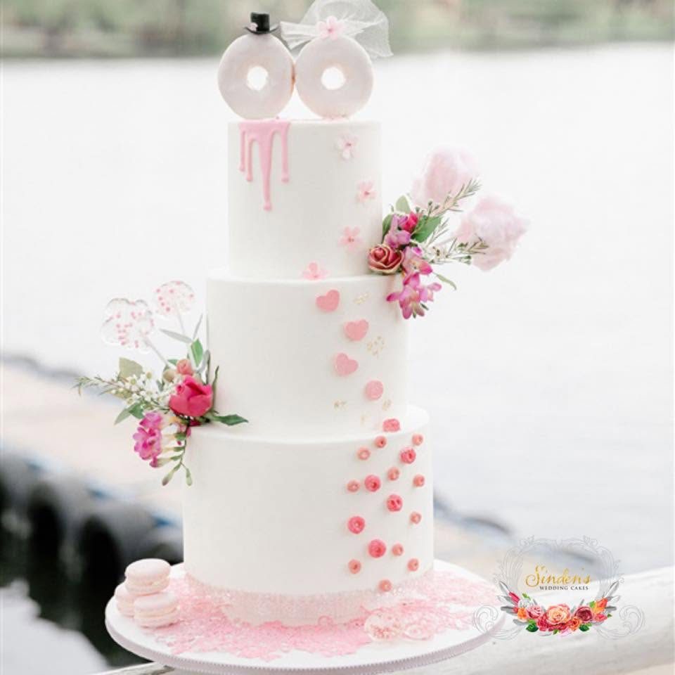 White wedding cake with delicate pink florals