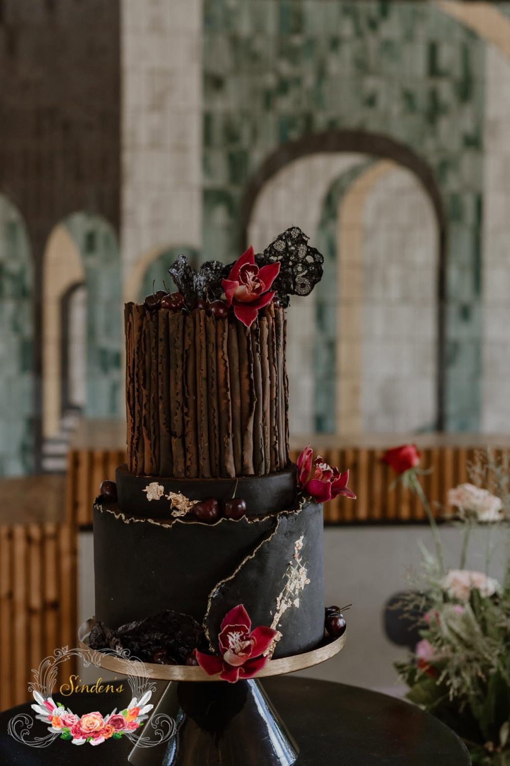 Floral arch with a dramatic cake display