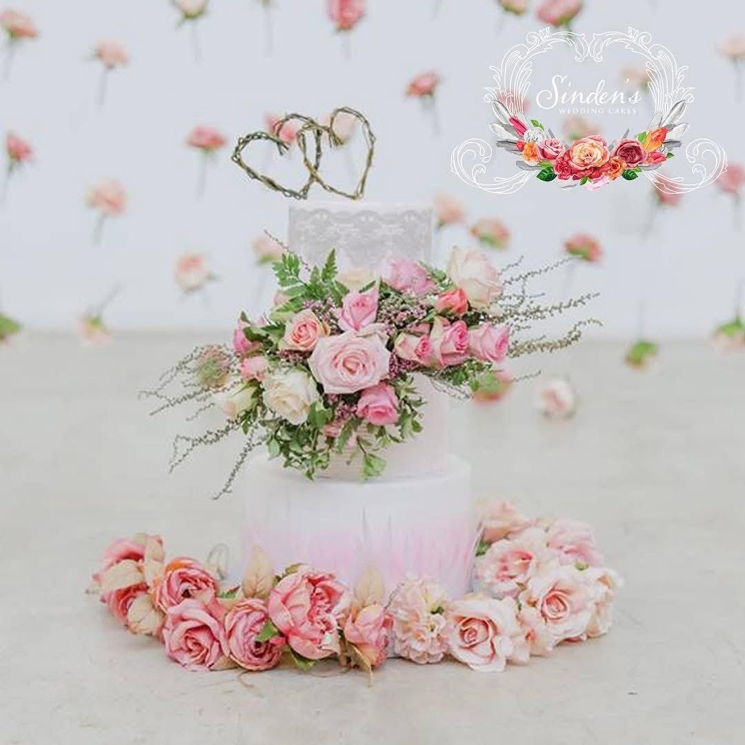 White cake with peach and pink florals