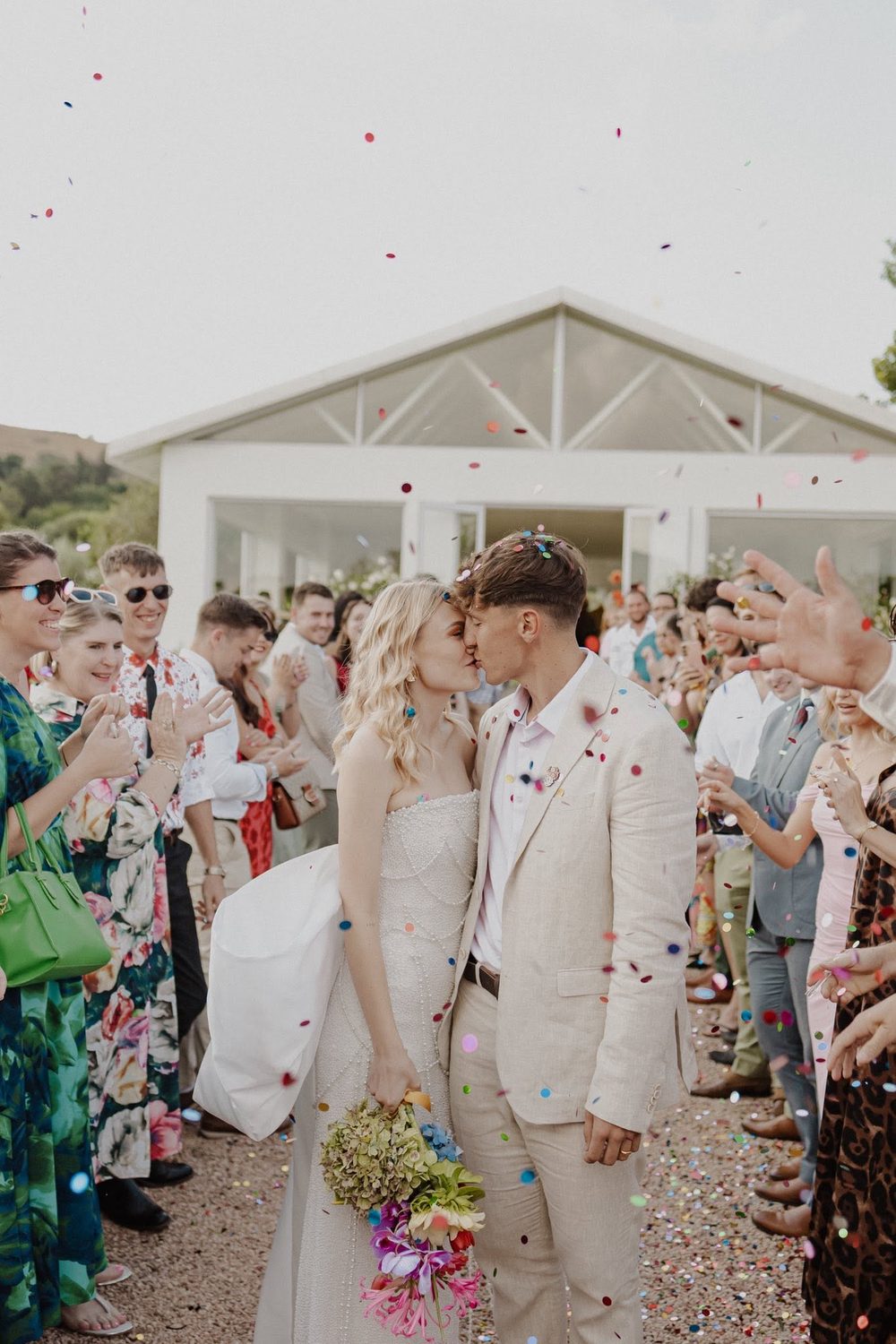 Newlyweds celebrating with confetti
