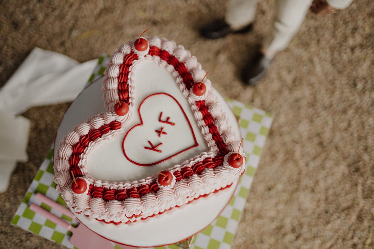 Vintage heart cake with red rosette piping