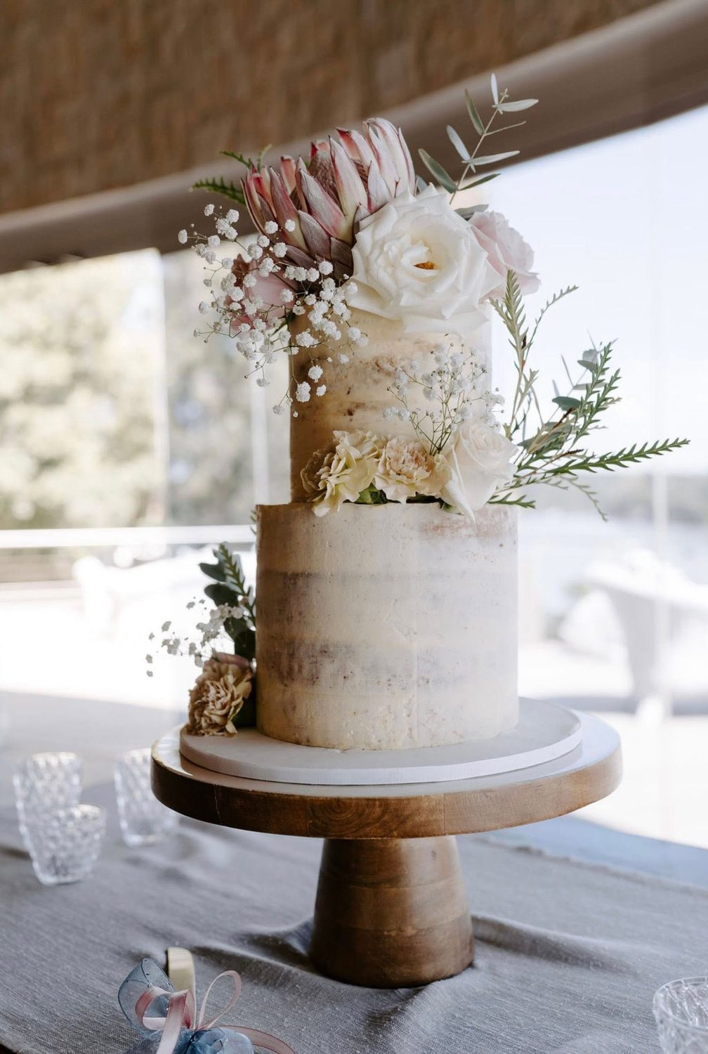White wedding cake with pink florals